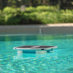 Maytronics Dolphin Skimmi Cordless Pool Skimmer paddling around pool on the hunt for leaves